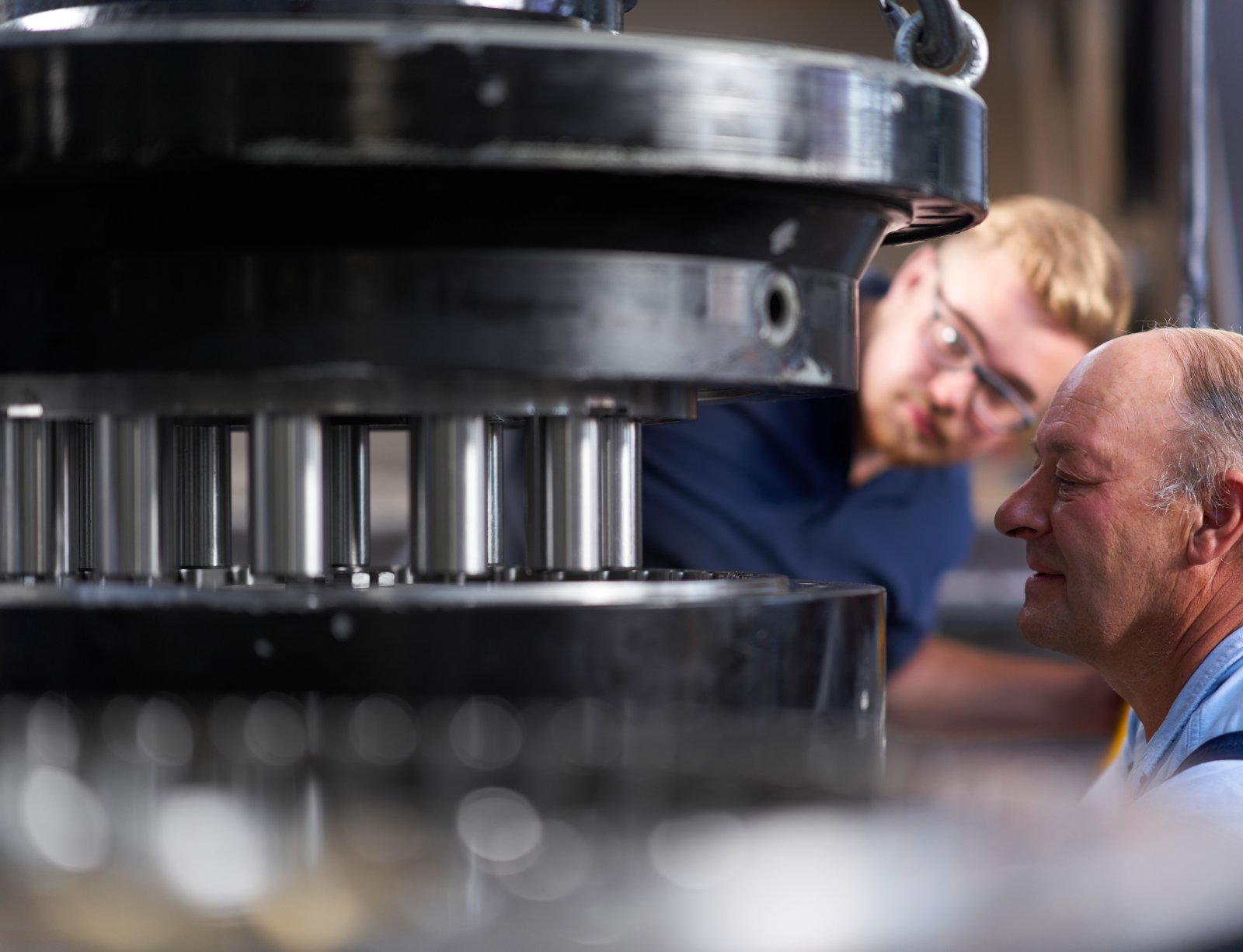 Man inspecting large gearbox