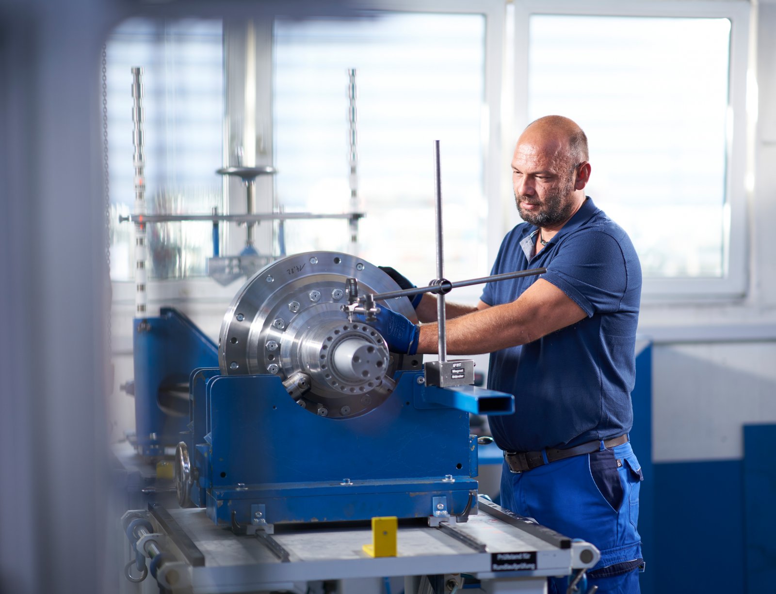 Technician inspecting a medium size gearbox